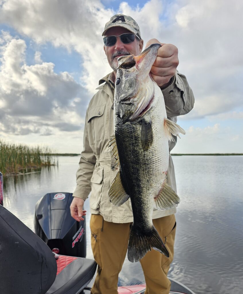 Man with the large bass he caught fishing
